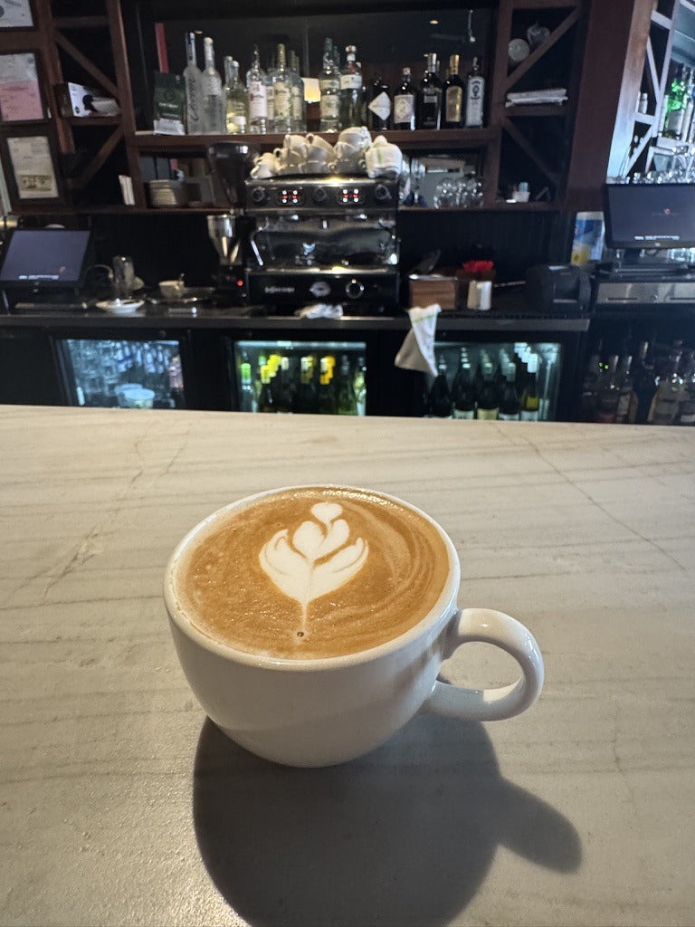 Latte with tulip art pulled from Sanctuary Roasting House Espresso Blend