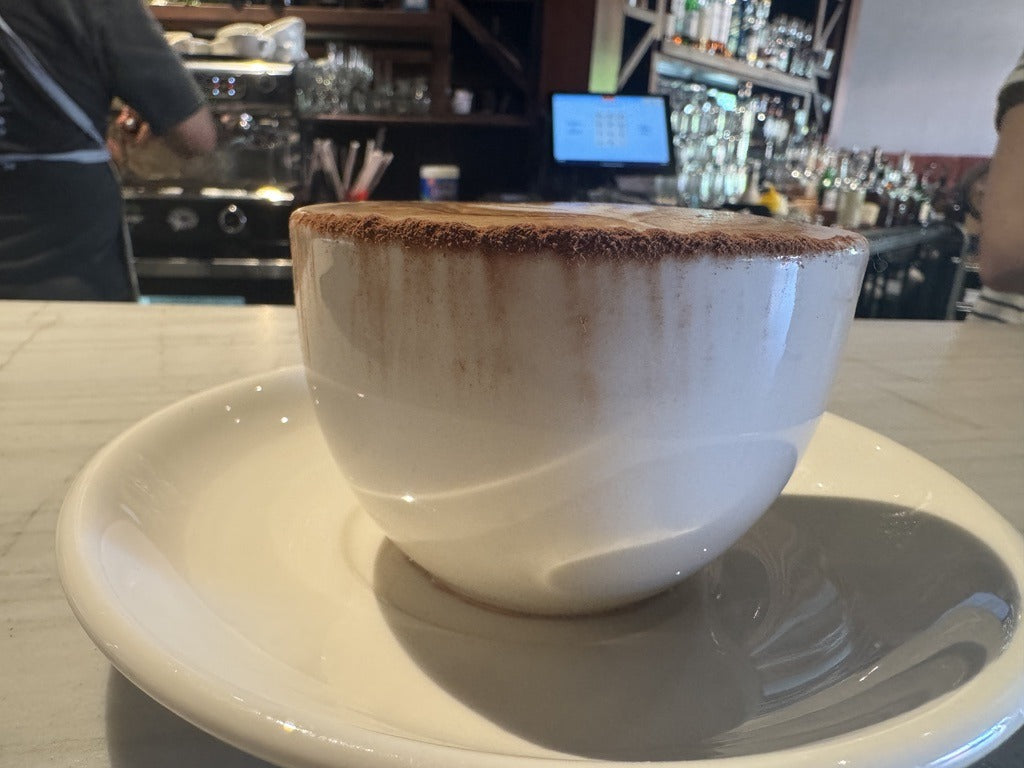 Cappuccino dusted with cocoa made with Sanctuary Roasting Midnight Oil dark roast