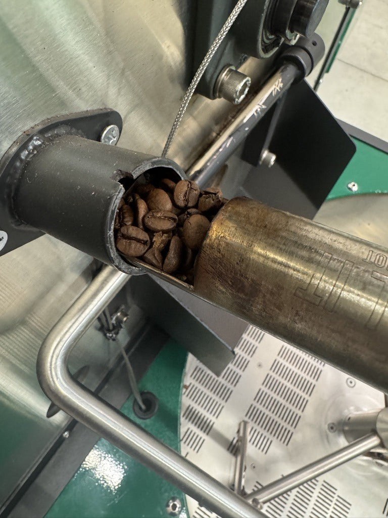 Dark roast House Espresso beans in the roaster tryer, small-batch roasted in Clovis CA