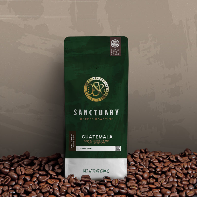 Sanctuary Coffee Roasting Guatemala Single Origin coffee bag, 12oz, medium roast, with roasted coffee beans.